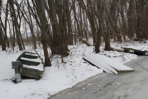On the right, you can see the boat has frozen into the river. Before a surprise raising of the river by the Army Corps, the boat was nearly three feet above the water line. 